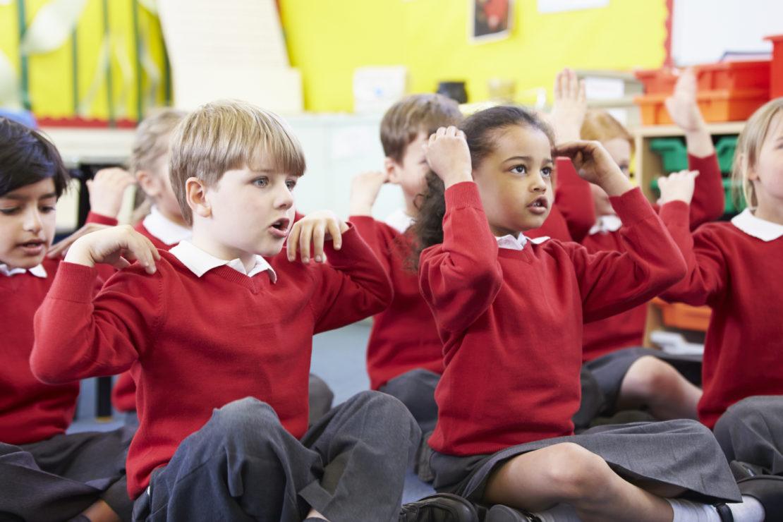 Pupils Performing Actions Whilst Singing Song